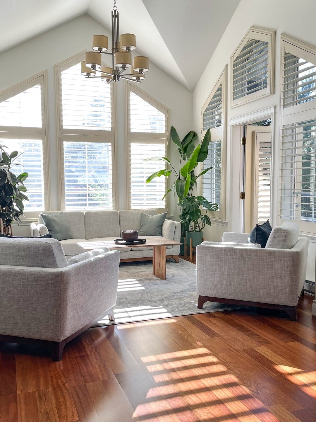Standard Room seating area with tall white shutters