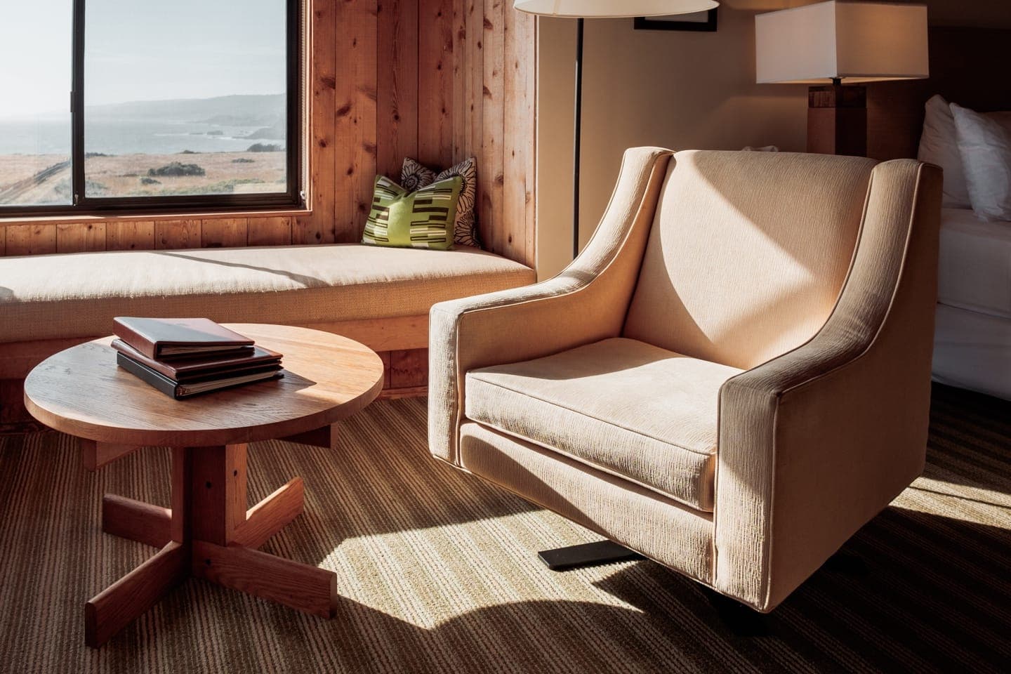 Standard Room lounge chair with landscape view