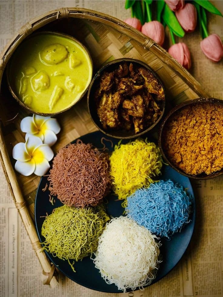 Traditional Sri Lankan string hoppers with curry and sambol